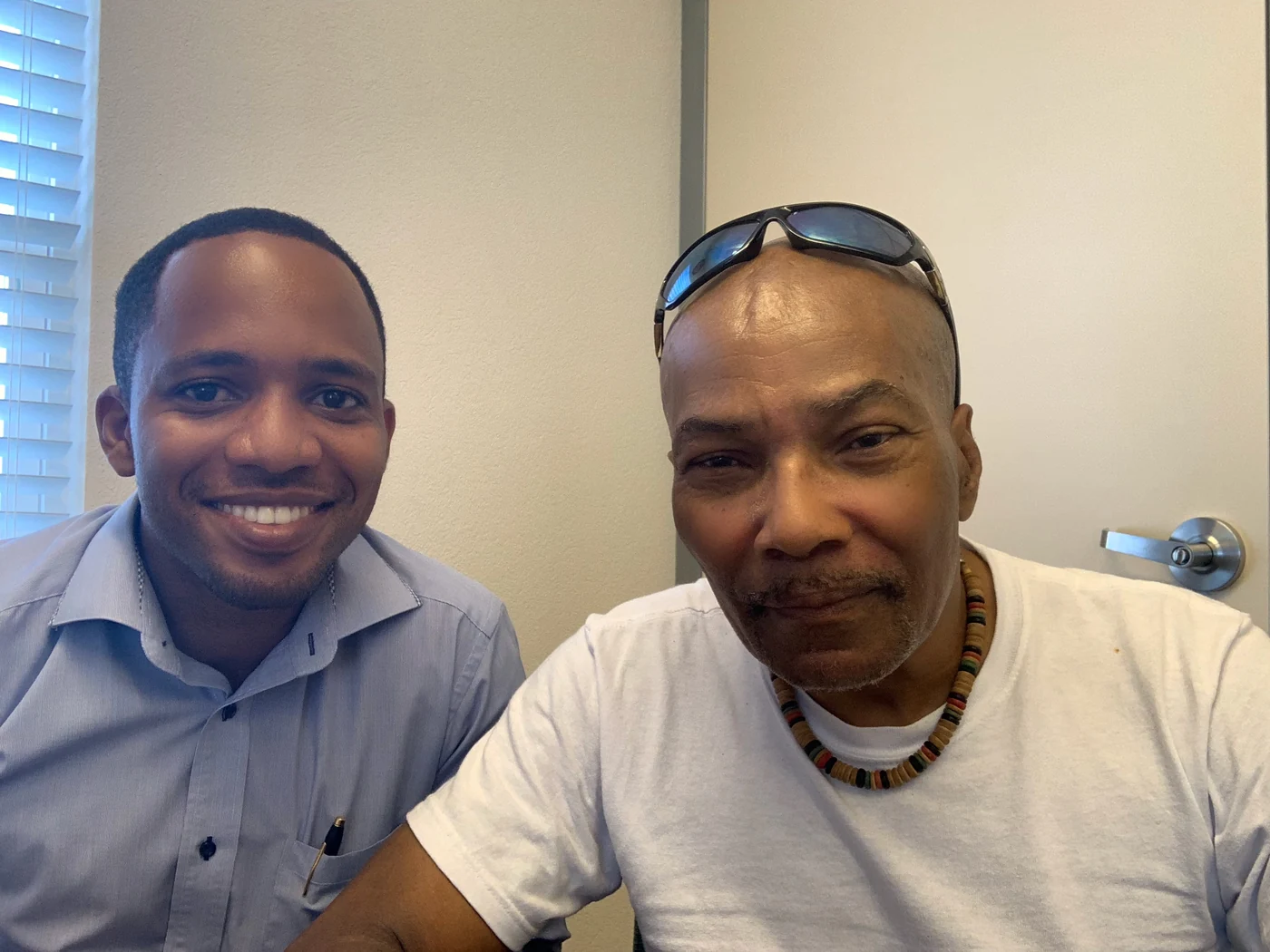 Jamar and a client in a casual photograph