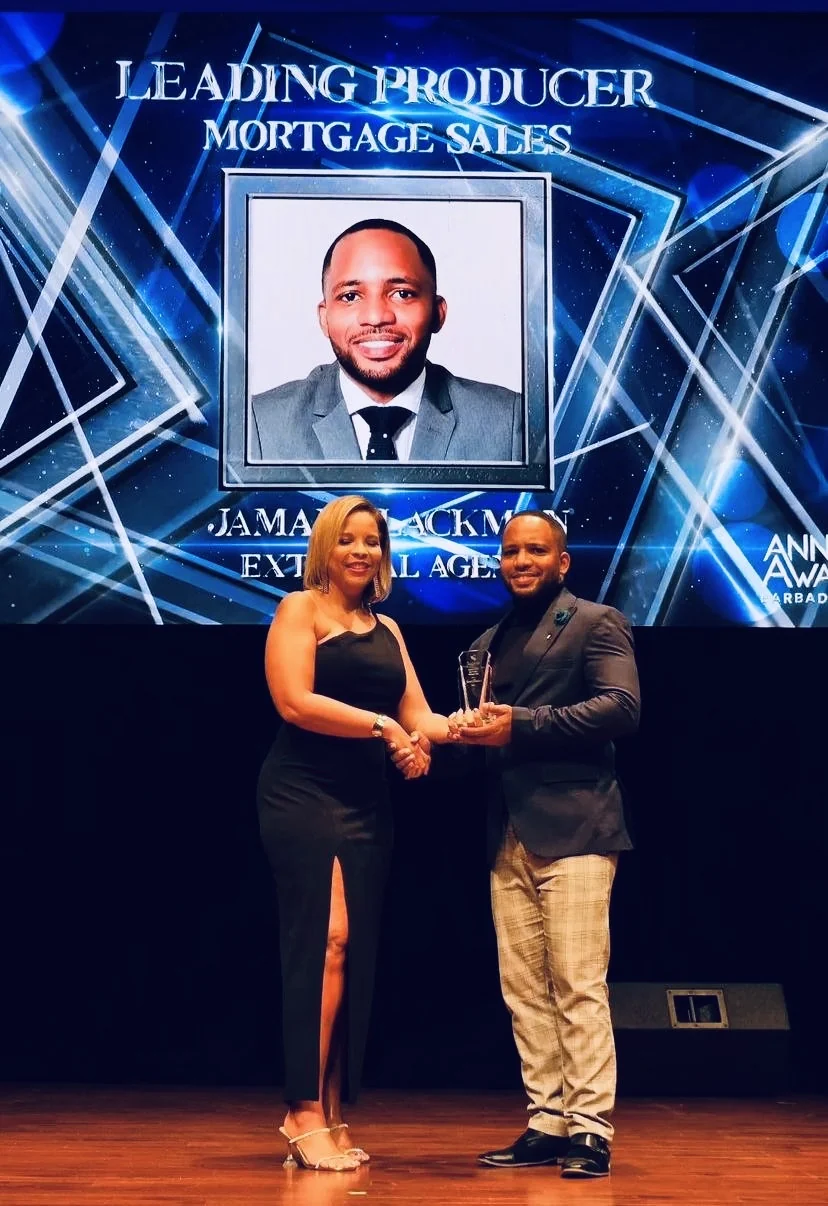 Jamar receiving a mortgage sales award on stage